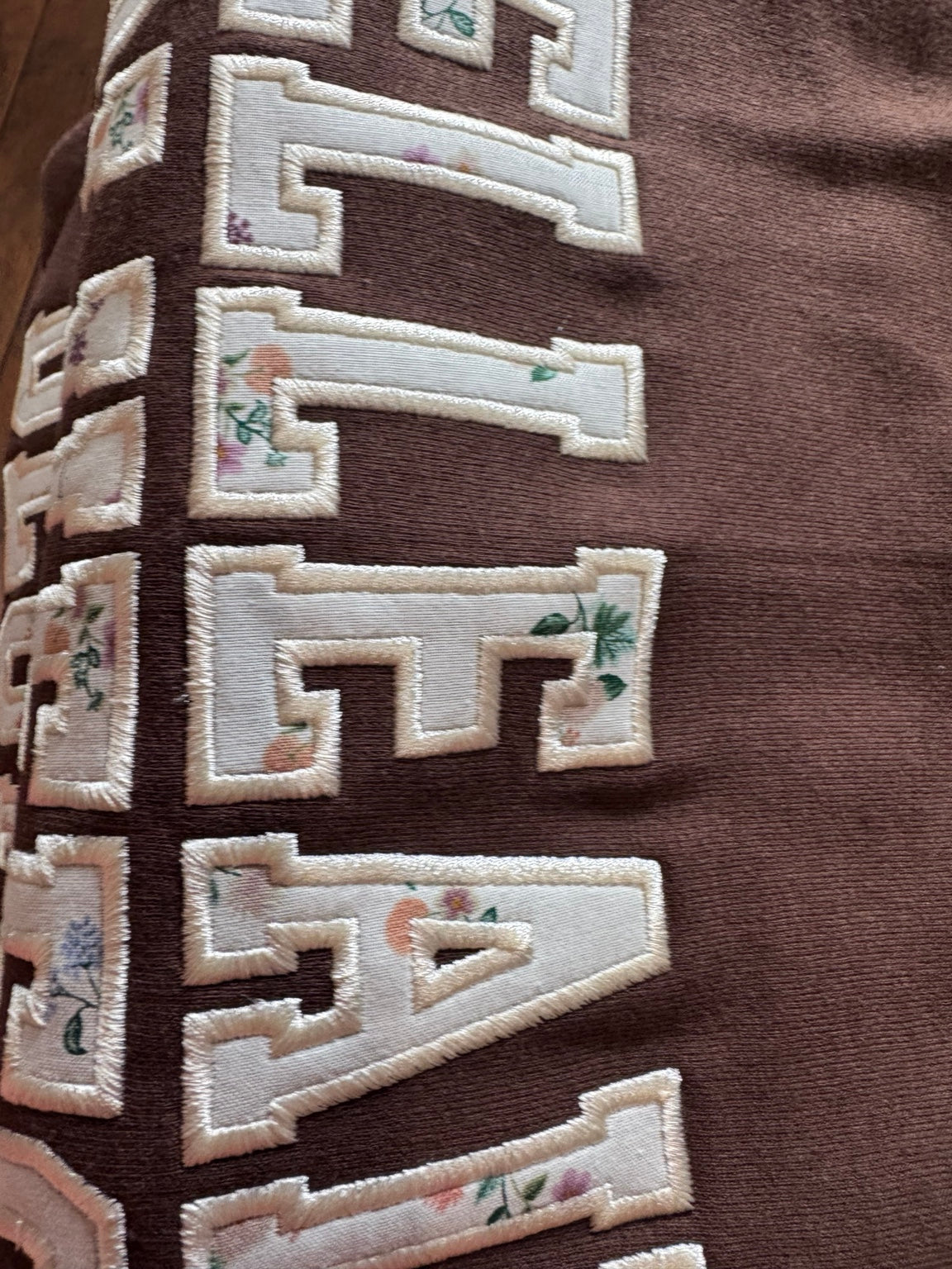 Original photo of Belleair Bluffs Crewneck fabric applique and embroidered stitching