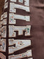 Original photo of Belleair Bluffs Crewneck fabric applique and embroidered stitching